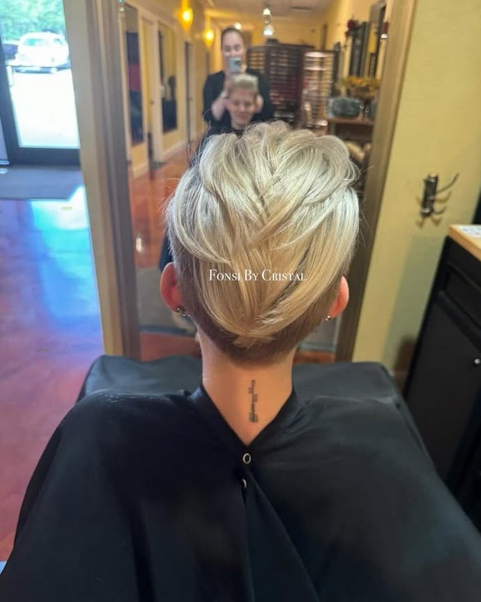 Textured pixie cut with blonde highlights